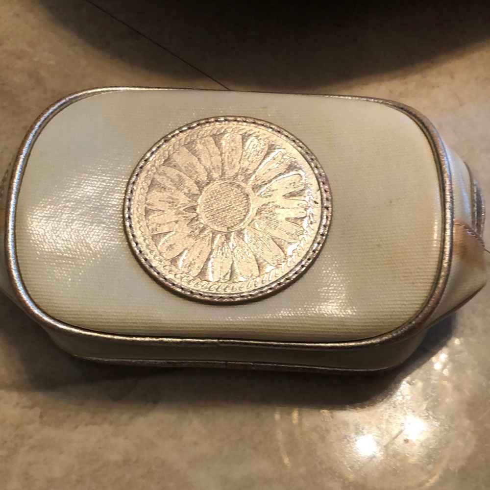 Tory burch never used cosmetics bag. Tan with gold detail.